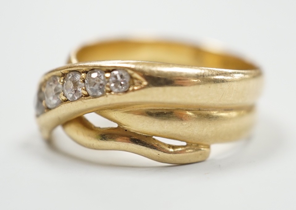 A late Victorian18ct gold and graduated five stone diamond set serpent ring, Hallmarked for Chester, 1897, size P/Q, gross weight 7.3 grams.